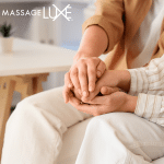 Couple holding hands in a calm, supportive moment to represent fertility self care and emotional support.